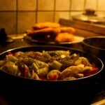 Fresh vegetables cooking in a pan on the stove