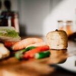 Fresh sliced vegetables on a wooden chopping board