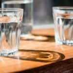Three clear glasses of water on a table