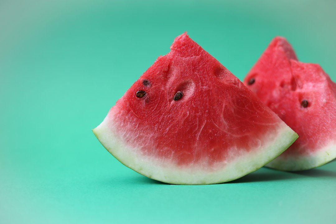 Fresh watermelon slices, a water-rich fruit that adds to daily fluid intake